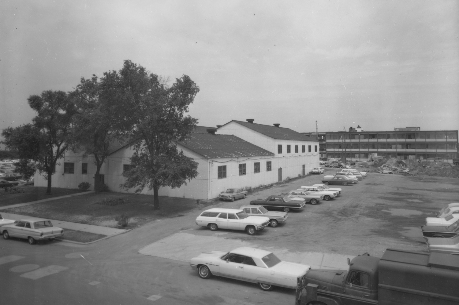 Gymnasium with Life Sciences Building under construction in background