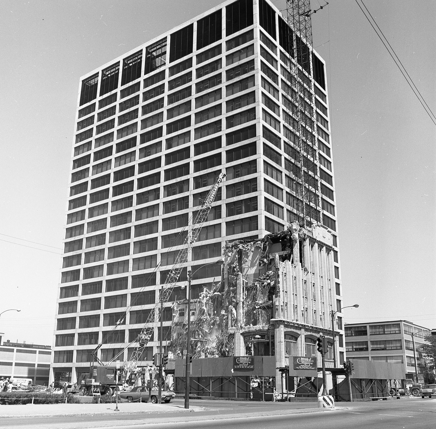 The Arcade Building being demolished, with IITRI Tower in the background